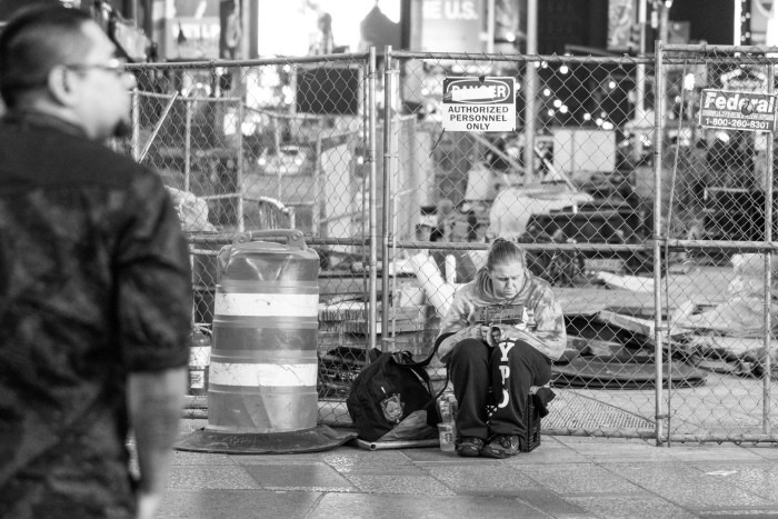 Homeless Woman Sits in Time Square NYC