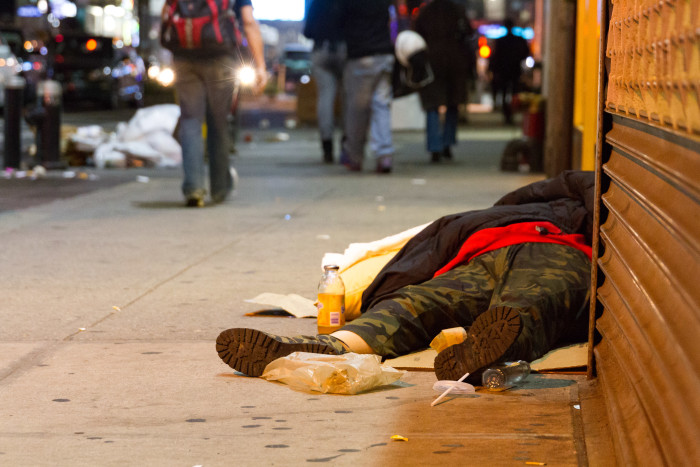 Homeless man Sleeps on Broadway NYC