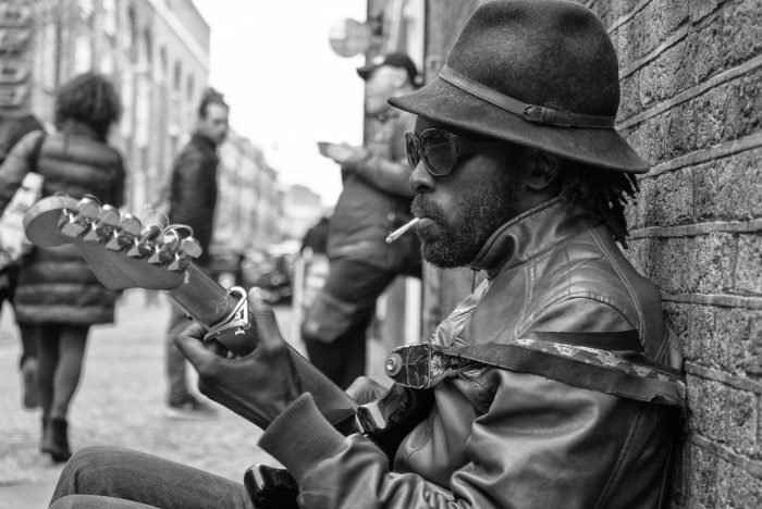 Guitarist in Londons Brick Lane Black and White Travel Portrait 