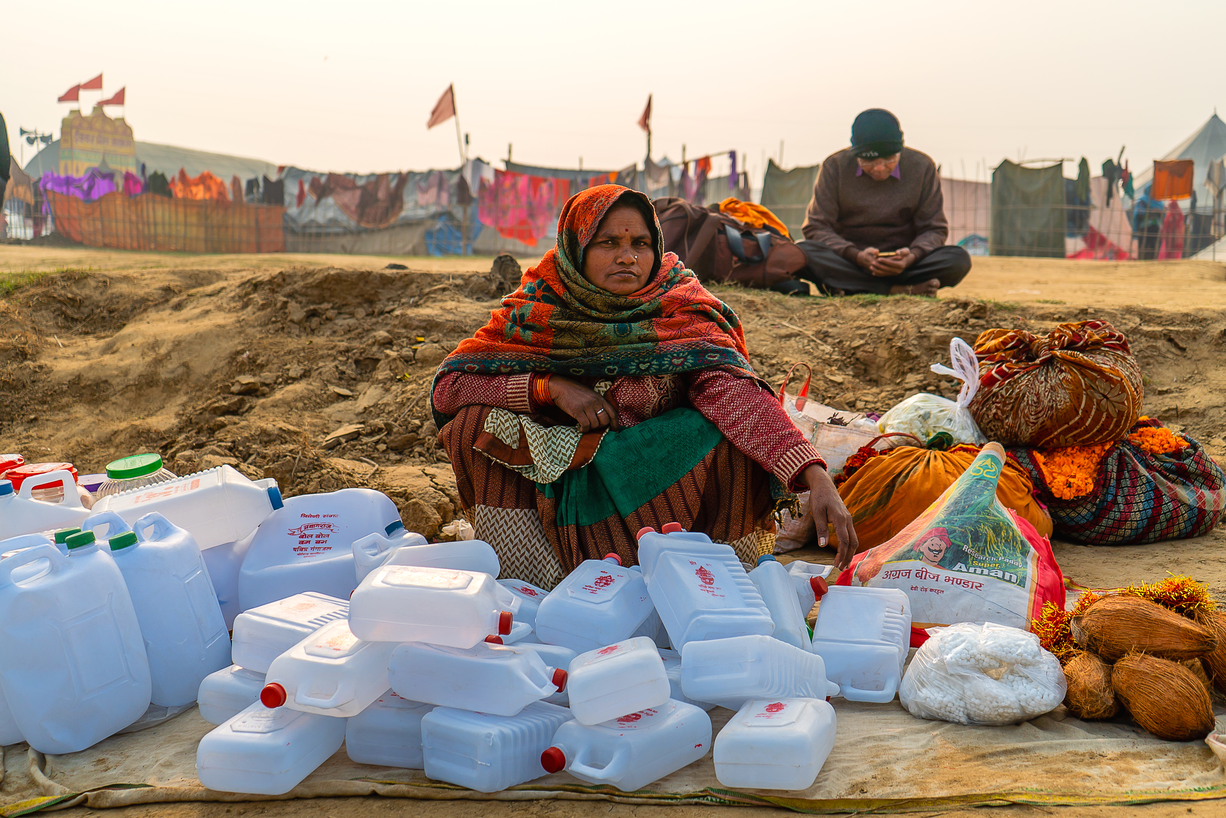 Woman Sells Water Jugs to take Holy Water from Kumbh Mela 2019